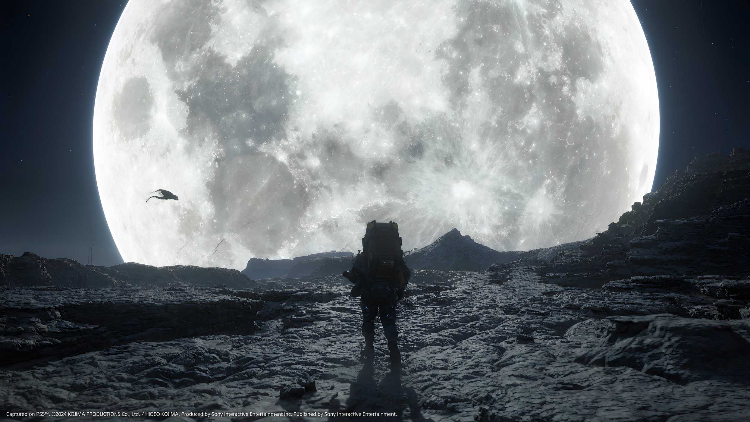 An image from the game Death Stranding 2: On The Beach, showing Sam's silhoutte against a huge, bright white moon.