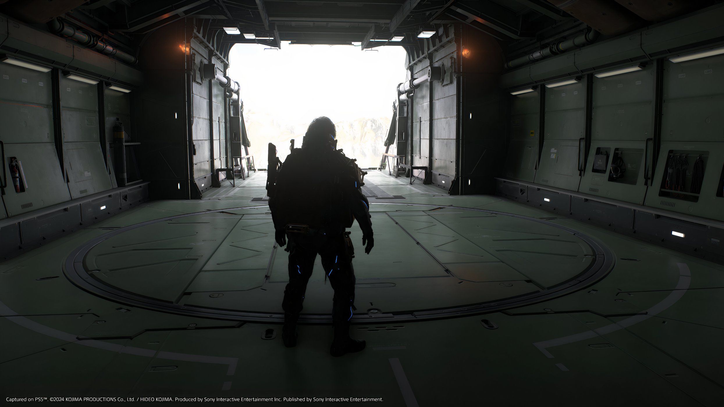 An image from the game Death Stranding 2: On The Beach, showing Sam's silhouette against an airplane hangar.