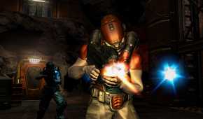 Two gunman walking through rocky cavern with doors.
