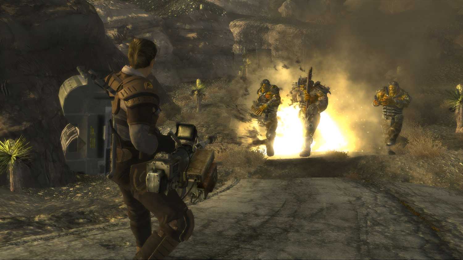 An image from the game Fallout: New Vegas, showing a man wielding a minigun at multiple charging hostiles.
