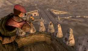 An image from the game Fallout: New Vegas, showing a man in uniform perched atop a lookout, aiming down with a sniper.