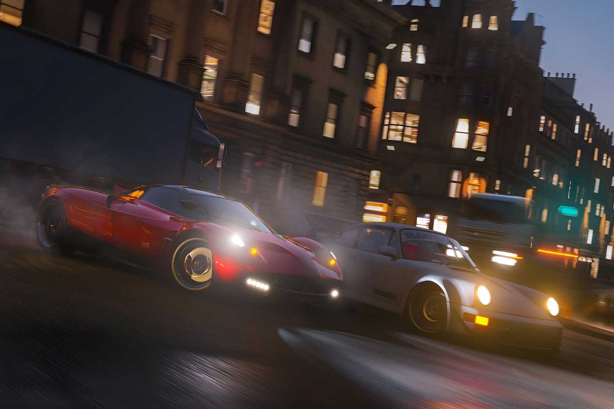 A screenshot from the game "Forza Horizon 4", showing a red Pagani Huayra racing against a Porsche at night in the streets of Edinburgh.