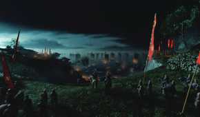 An image from Ghost of Tsushima, showing samurai lining up near a beach with their banners raised high.