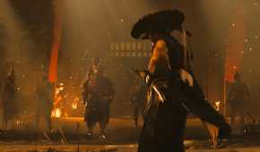 An image from the game Ghost of Yotei, showing a woman unsheathing her sword while facing off against multiple enemies.