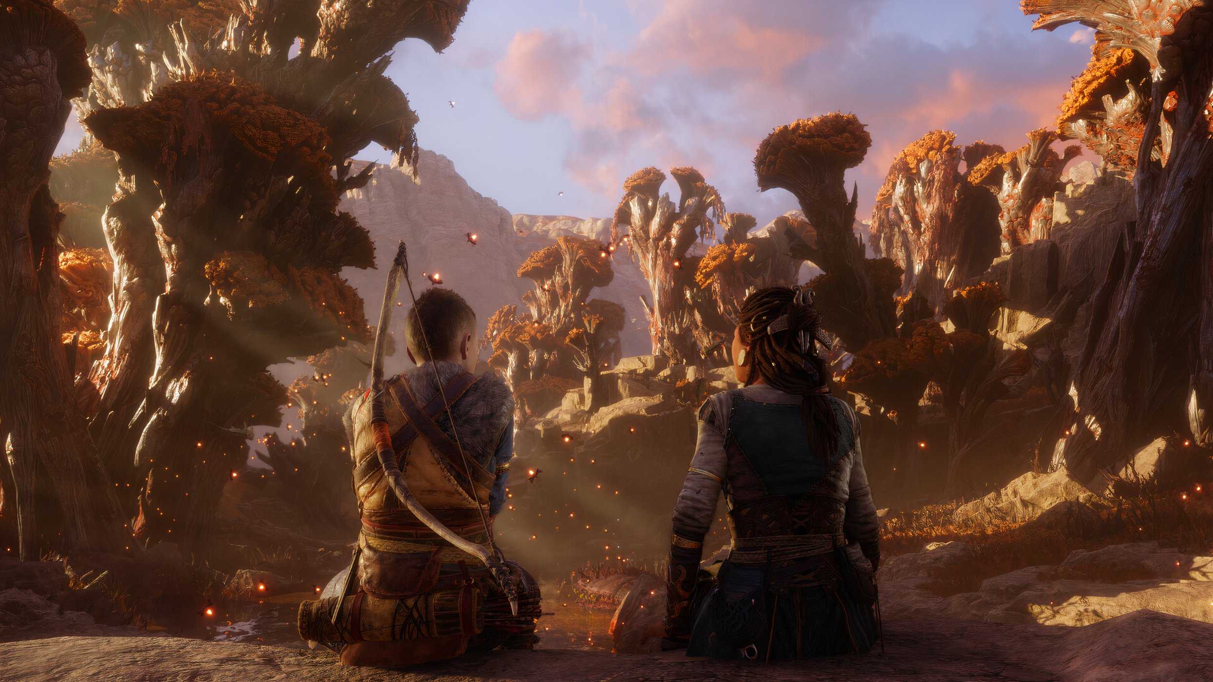 An image from the game God of War Ragnarok, showing Atreus and Angrboda sitting in Ironwood, a mythical forest.