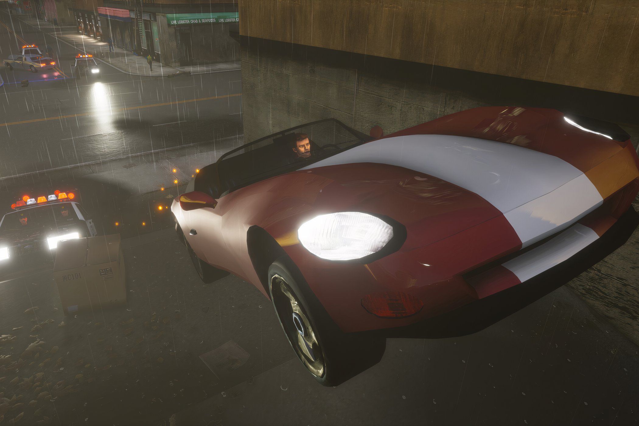 An image of the player in GTA 3 riding a red and white car while the cops chase.