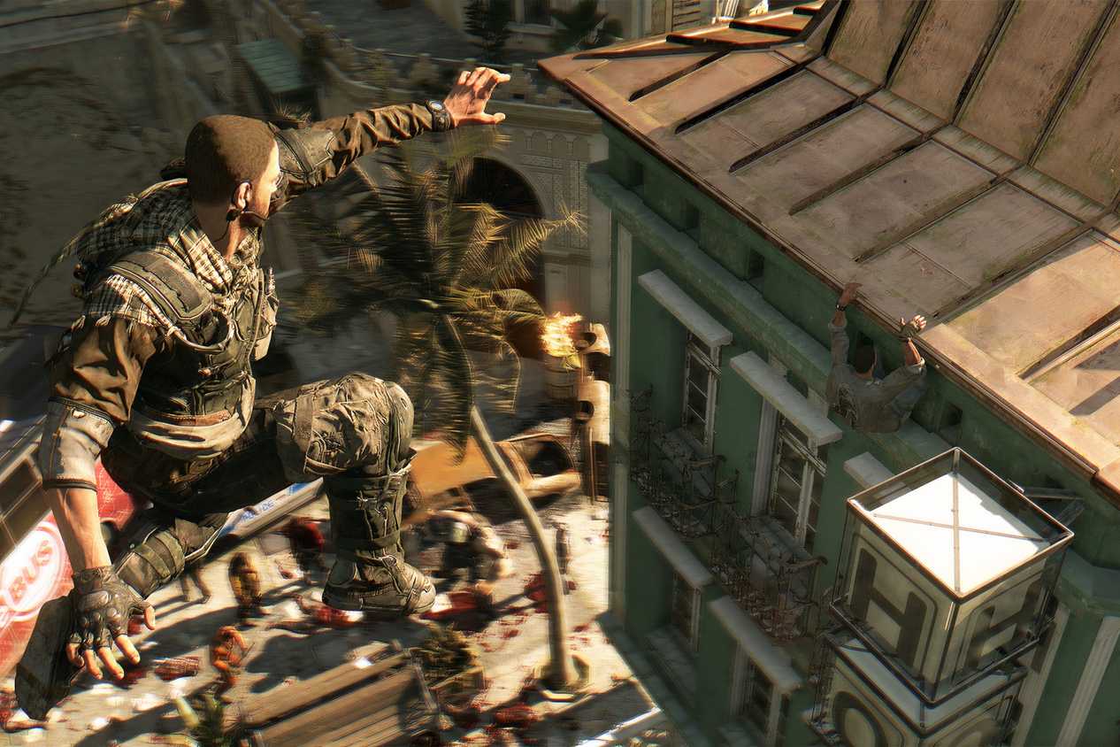 A screenshot from Dying Light, showing a man leaping across rooftops.