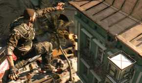 A screenshot from Dying Light, showing a man leaping across rooftops.