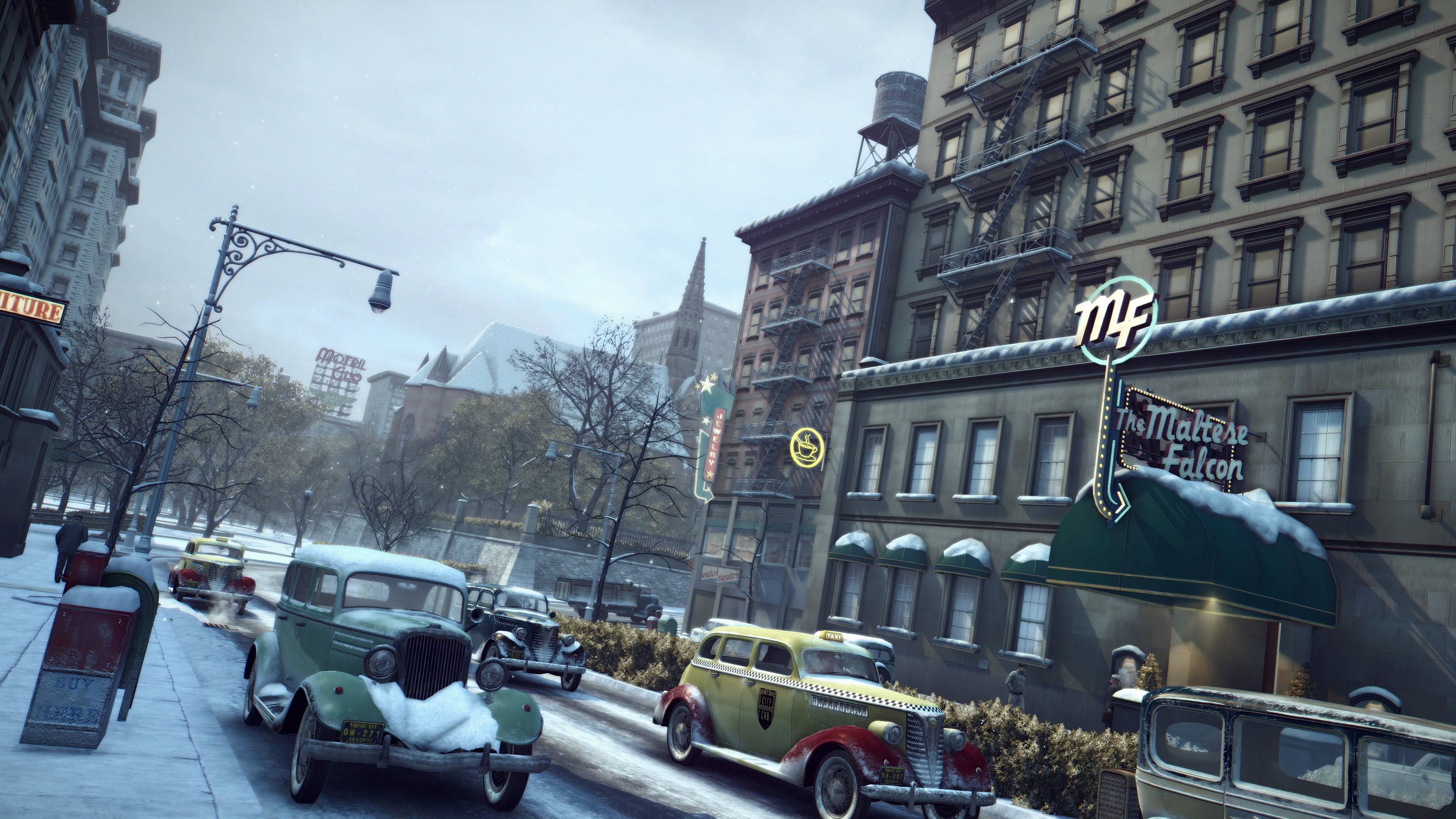 An image from the 2020 remaster of Mafia II, showing the game's city, with roads and cars coated in layers of snow.