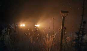 An image from the game Mafia: The Old Country, showing a dark atmosphere lit only by a car's headlights.