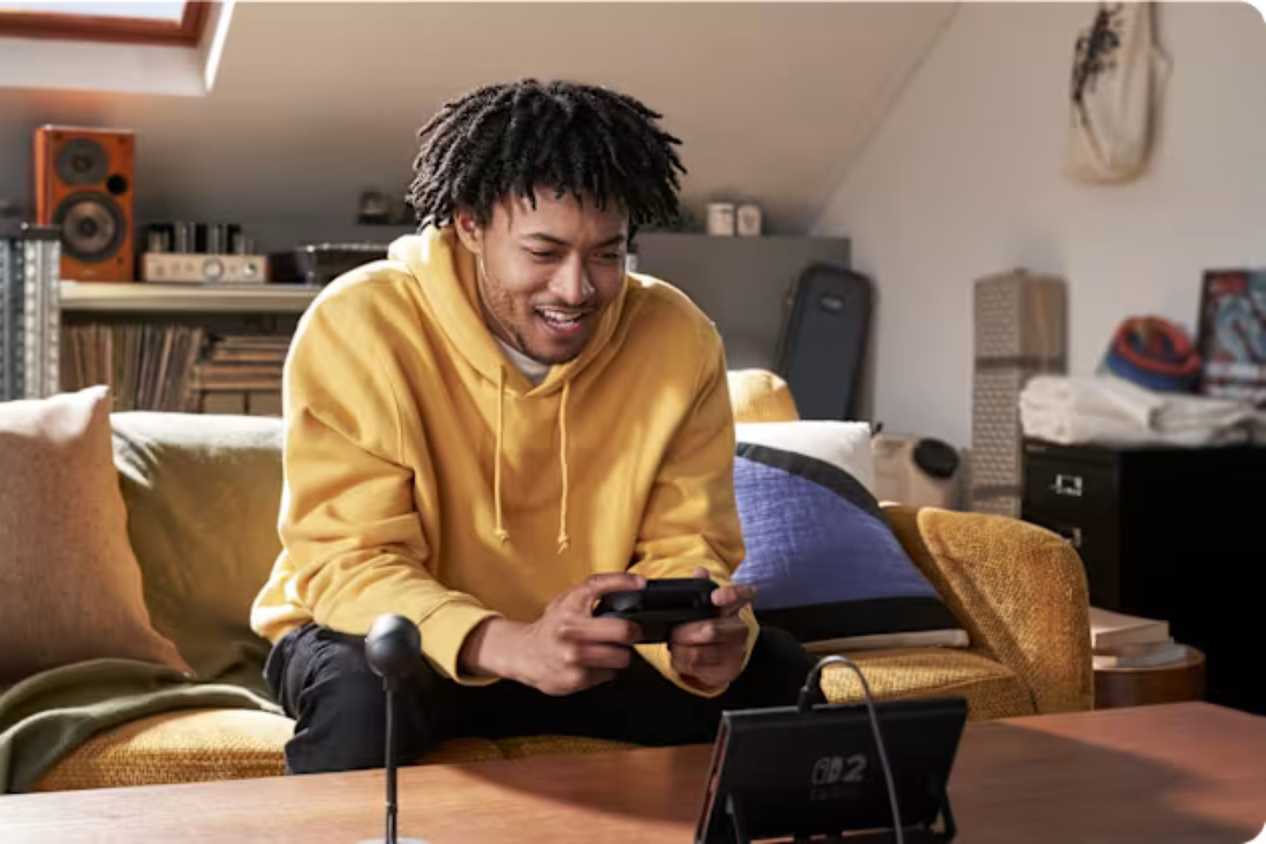 Nintendo Switch 2 player on Couch playing in handheld mode
