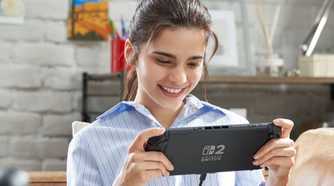 Nintendo Switch 2 player holding system in handheld mode