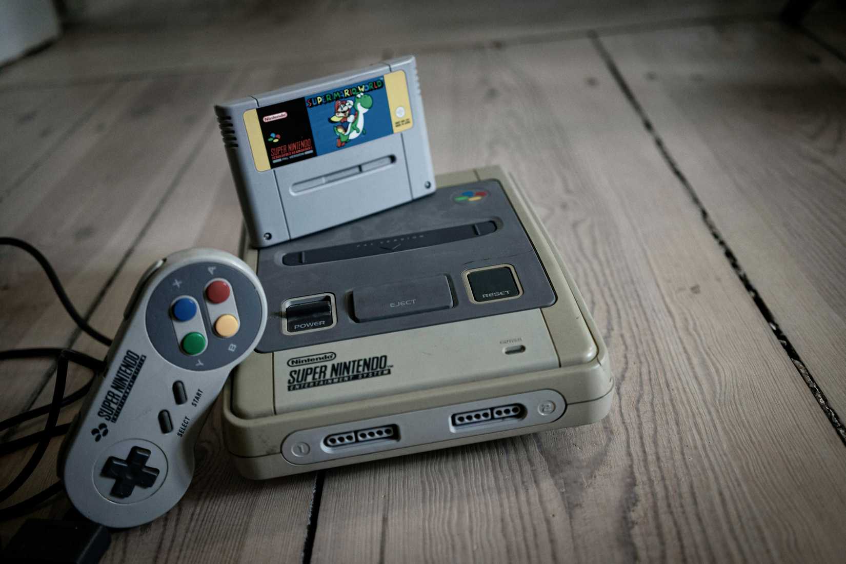 A picture of the Super Nintendo Entertainment System and a controller.