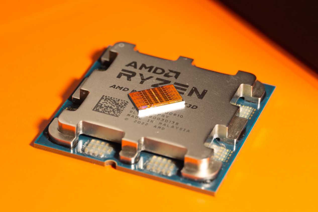 Close-up of an AMD Ryzen CPU on a yellow background