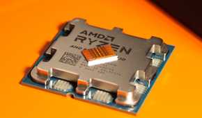 Close-up of an AMD Ryzen CPU on a yellow background