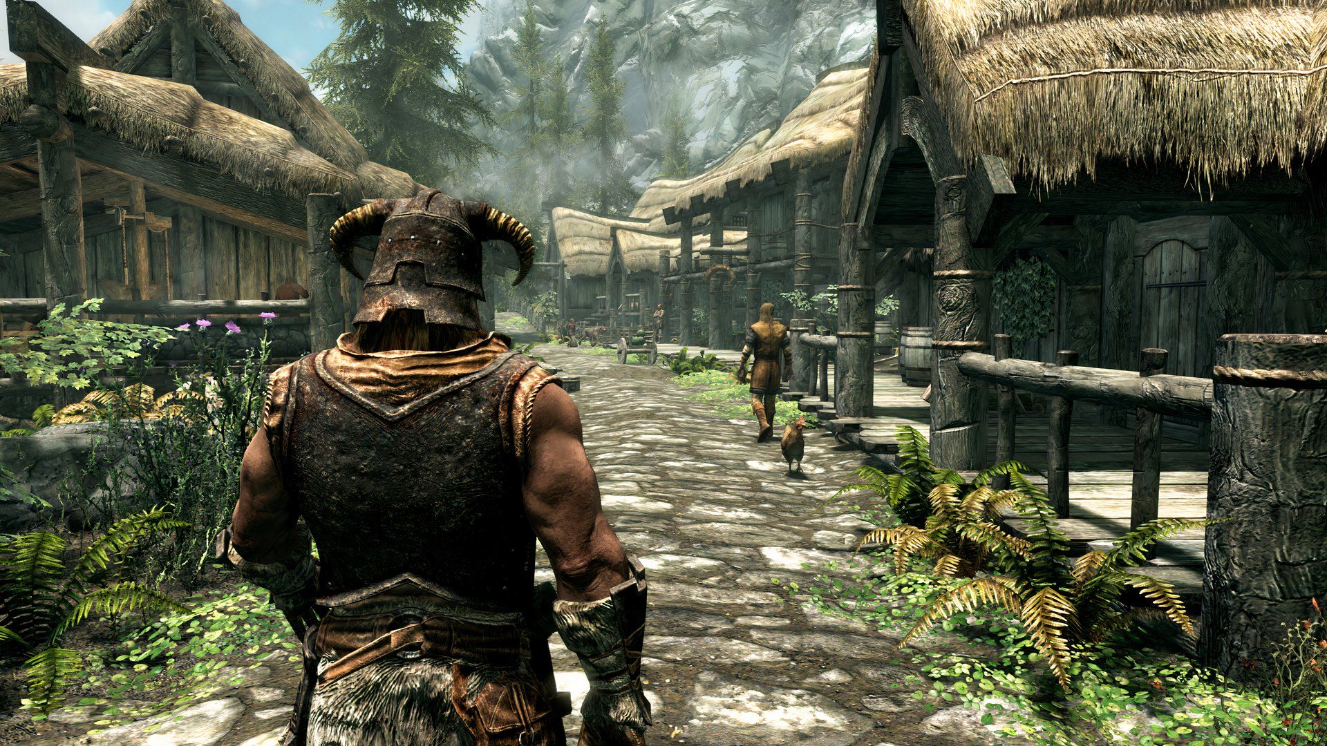 An image from the game The Elder Scrolls V: Skyrim, showing the Dragonborn character walking down a paved village road.