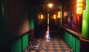 Kandyland hallway with bright lights and door
