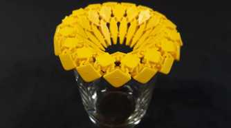 Sunflower fabric coaster on top of a glass