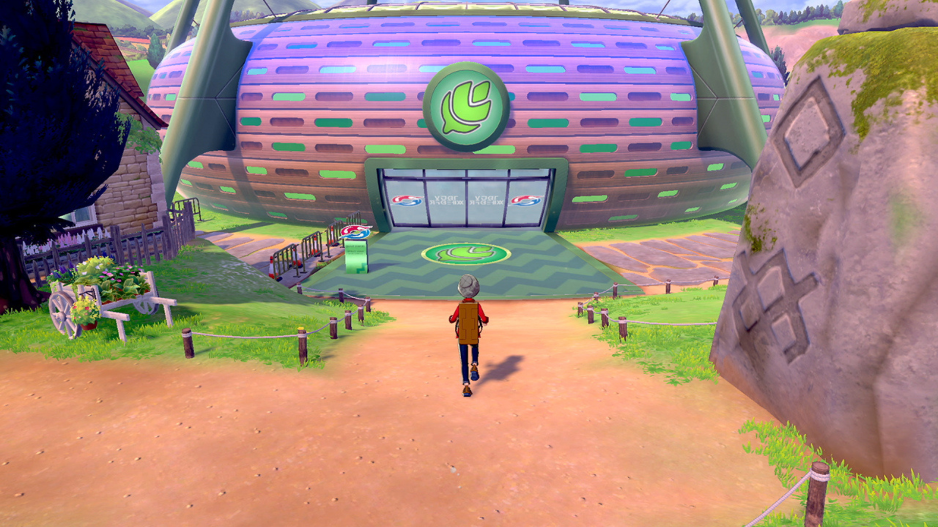 A trainer walking into a building