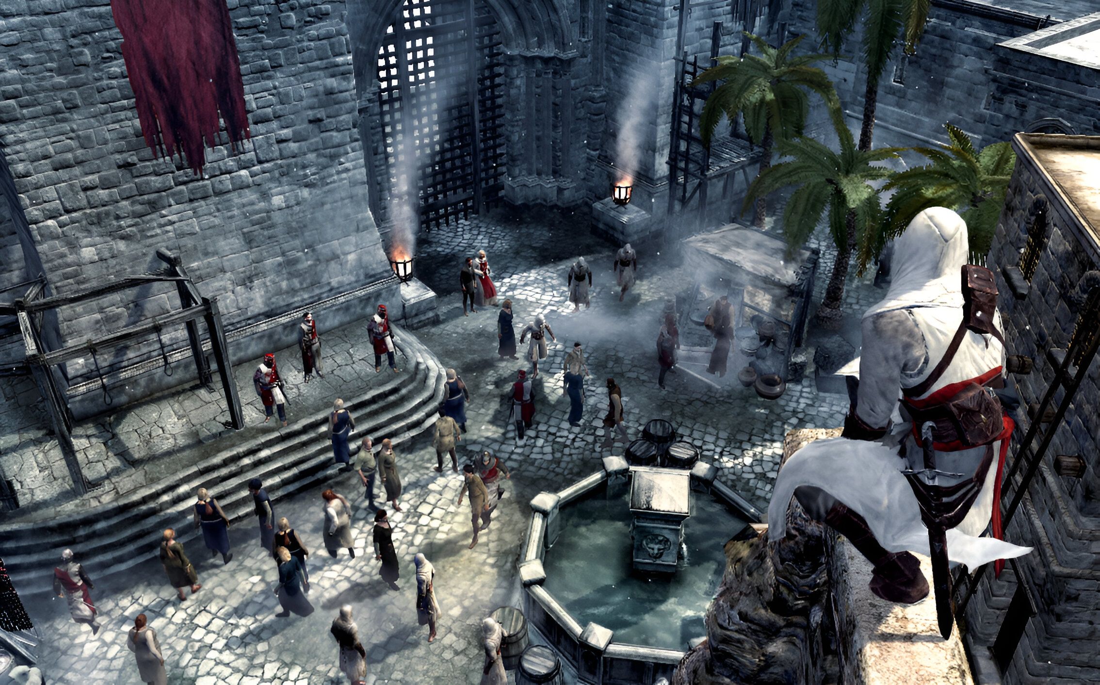 Altair perched atop a high ledge overlooking a fountain in Assassin's Creed.