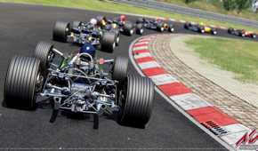 A screenshot from the game "Assetto Corsa", showing multiple Formula cars racing on the track.