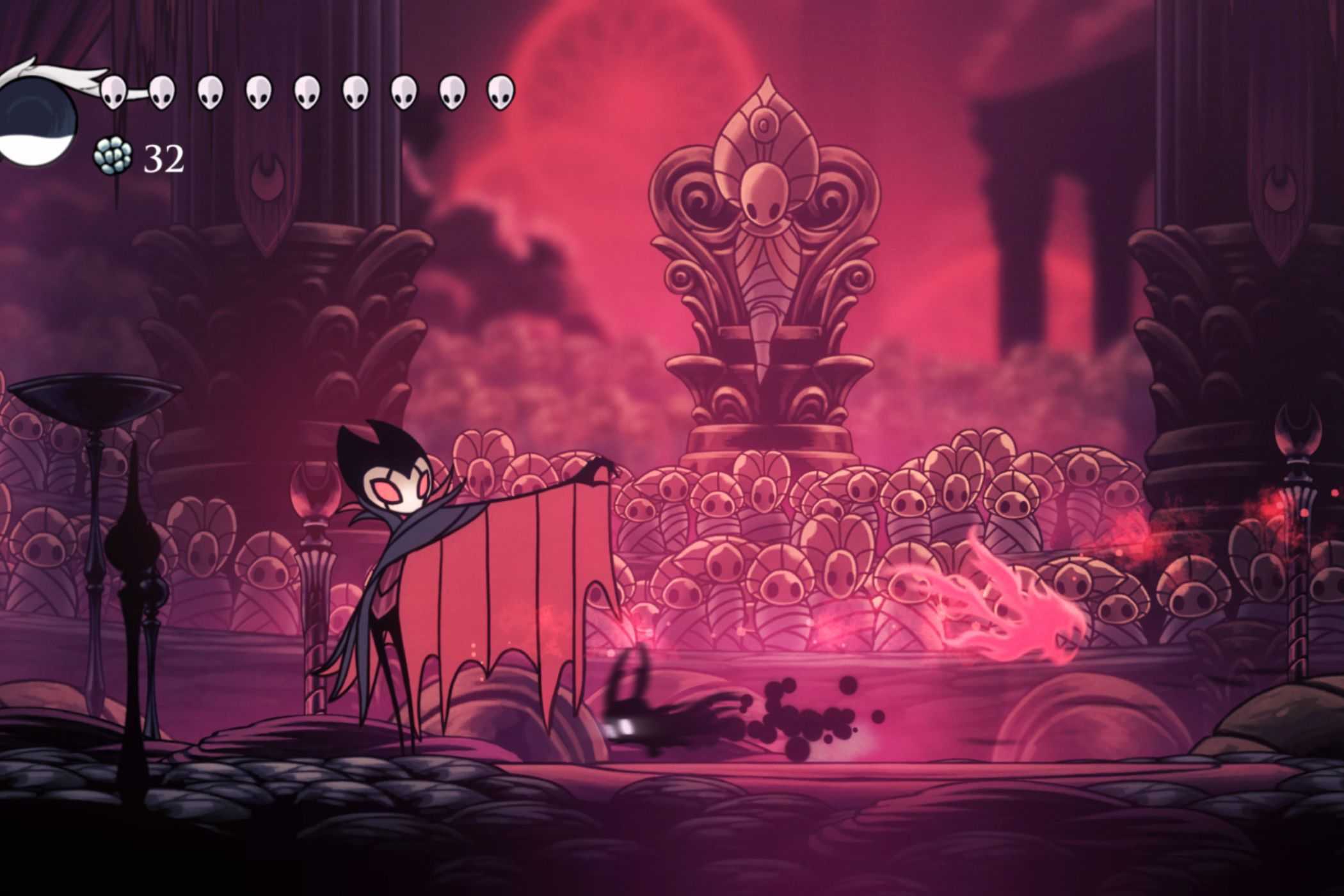 Hollow Knight fighting larger bug boss as shadow