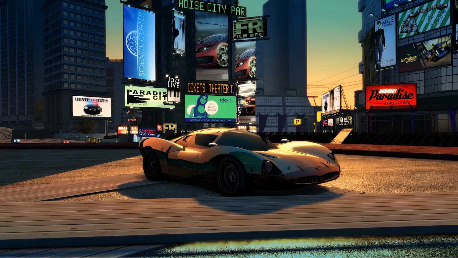 A screenshot from the game Burnout Paradise Remastered, showing a three-quarters front angle of a car while the sun sets.