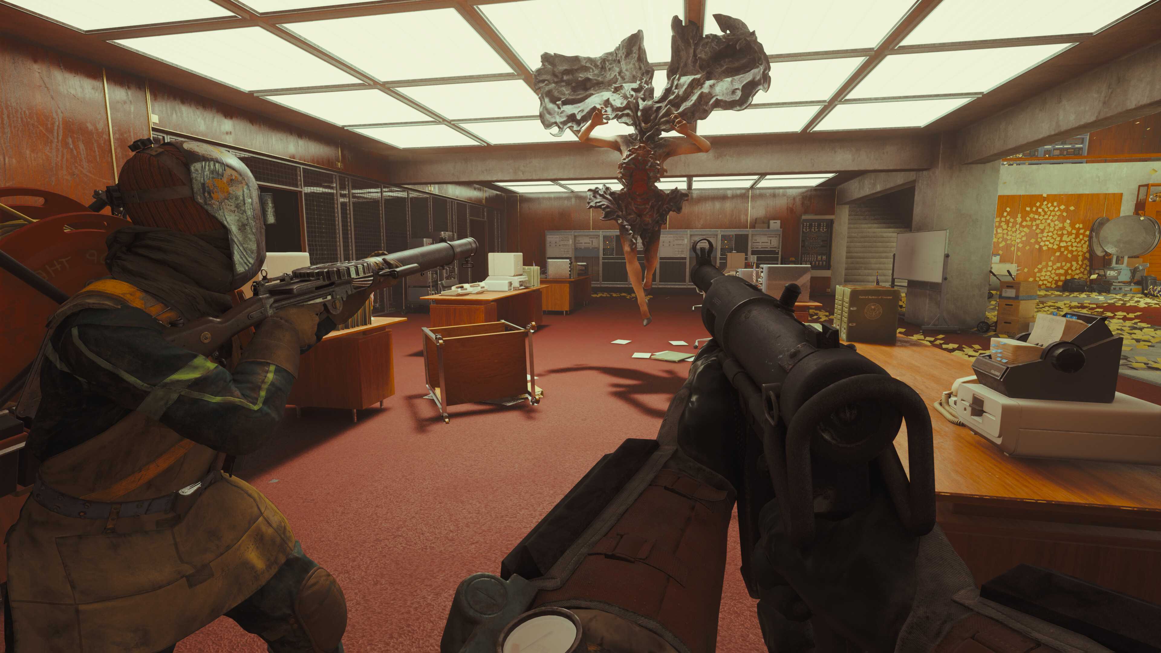 A screenshot from the game "FBC: Firebreak", showing an office environment as players aim their weapons at an airborne hostile entity.