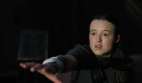 A screengrab from episode 4 of the HBO show The Last of Us Season 2, showing Ellie raising her arm out with a terrified look on her face.