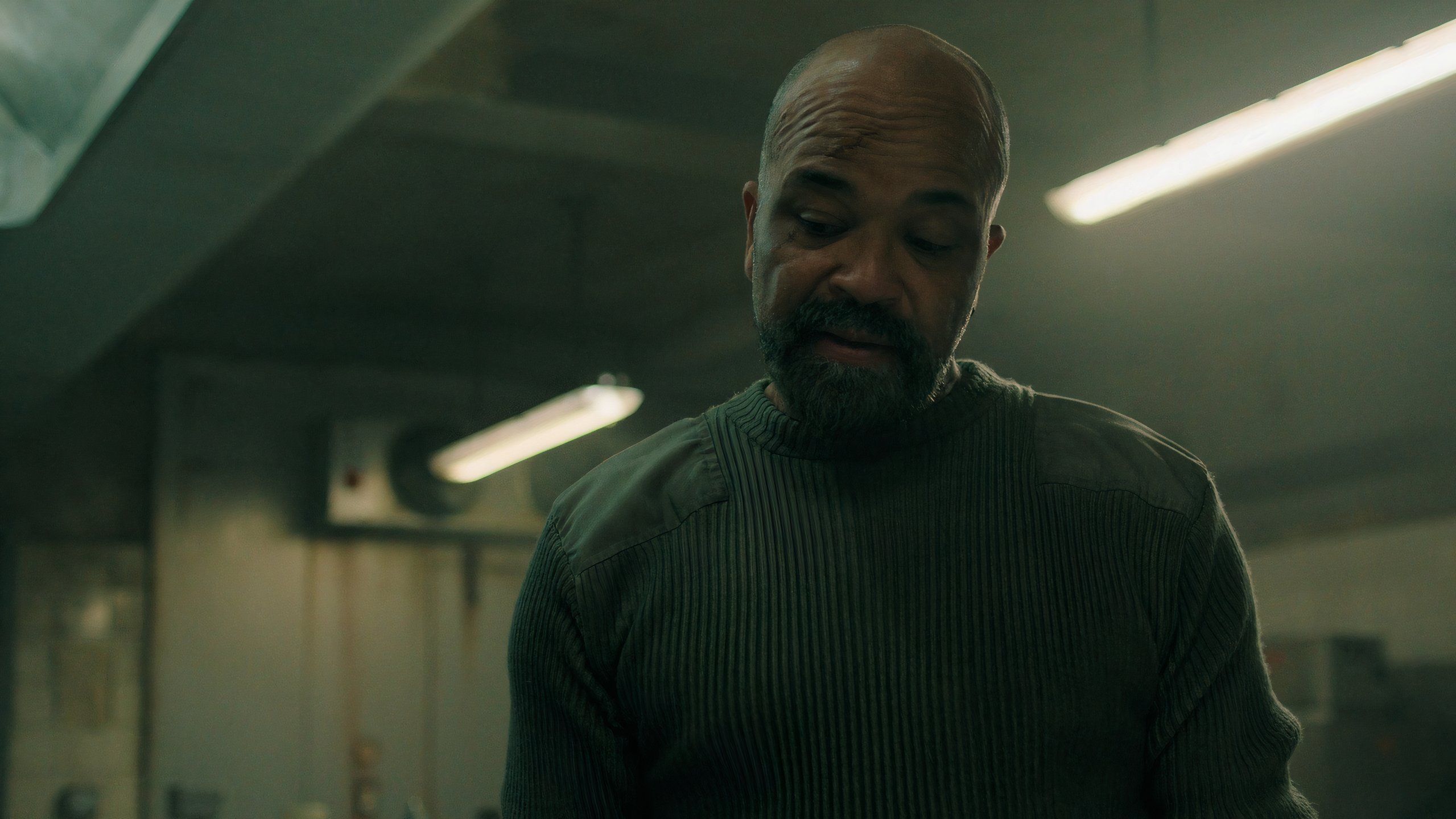 A screengrab from episode 4 of the HBO show The Last of Us Season 2, showing Isaac Dixon in a kitchen.