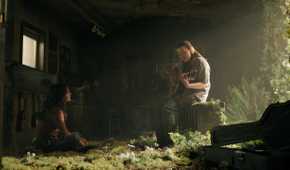 A screengrab from episode 4 of the HBO show The Last of Us Season 2, showing Ellie playing the guitar for Dina.