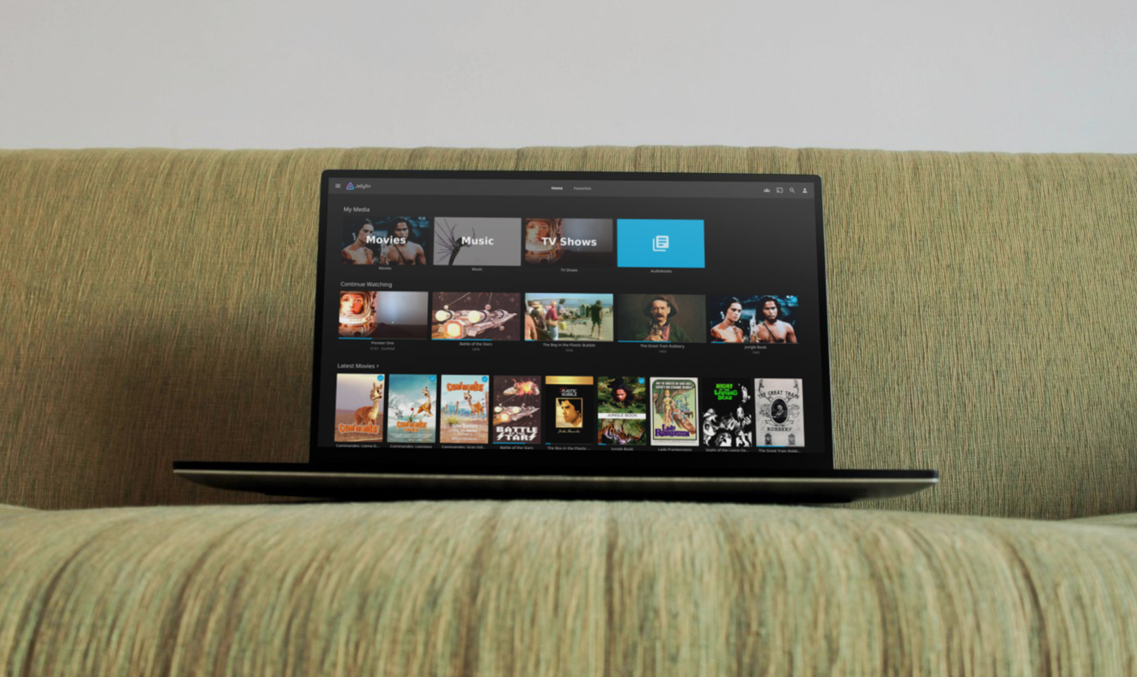 A laptop is kept on a sofa