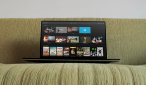 A laptop is kept on a sofa