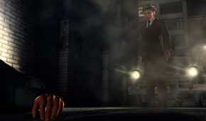 Cole Phelps standing in front of a car with its headlights on in L.A. Noire.