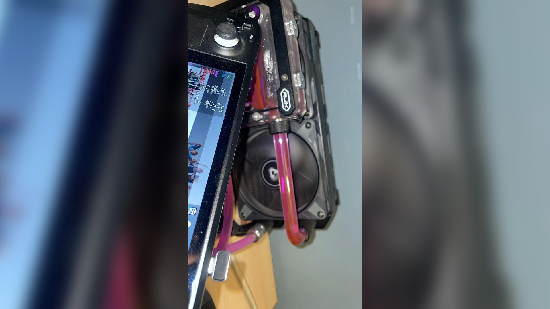 Someone built a custom liquid cooling loop for their Steam Deck because ...