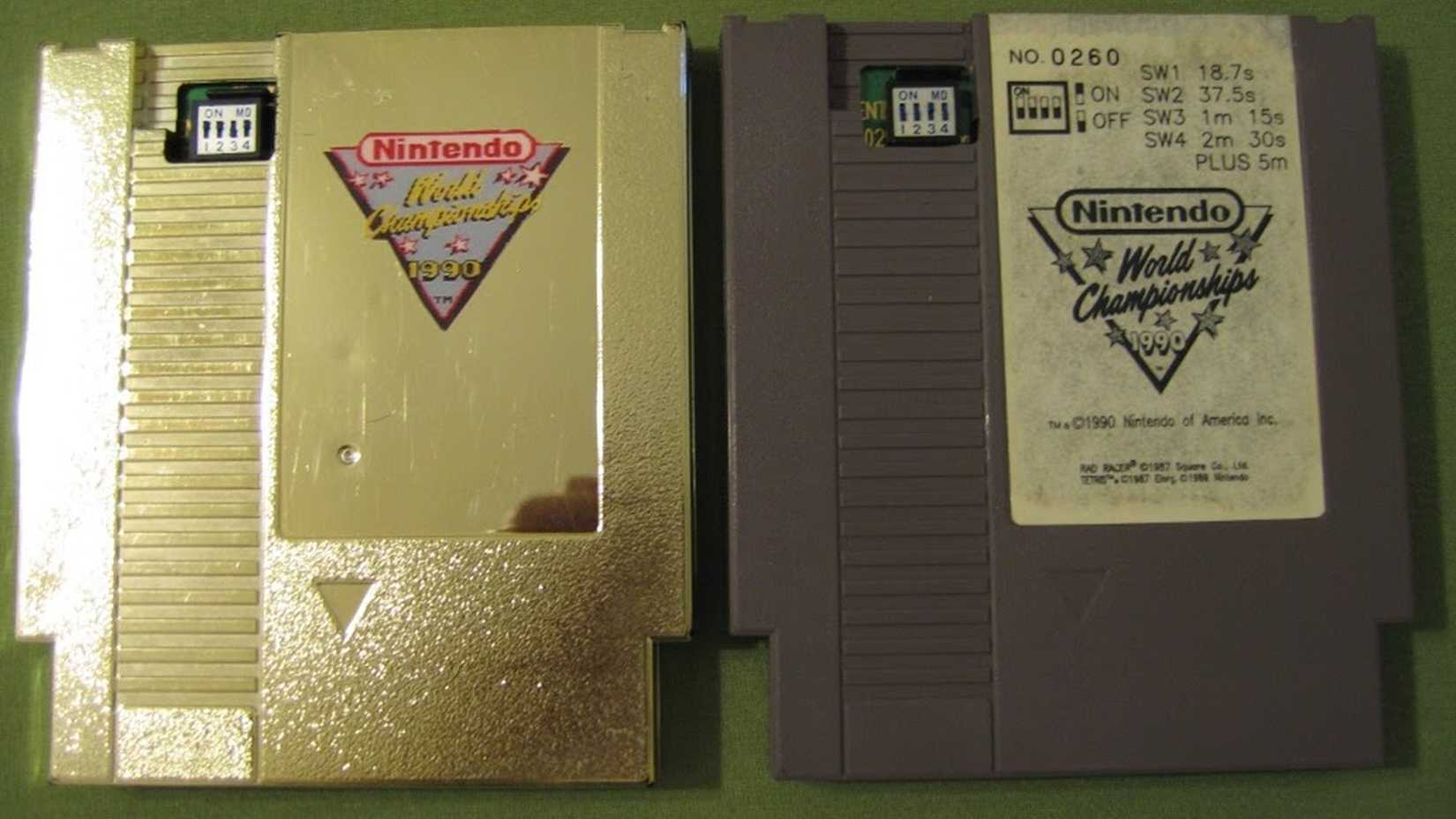 A picture of the gold and standard cartridges for Nintendo World Championship.