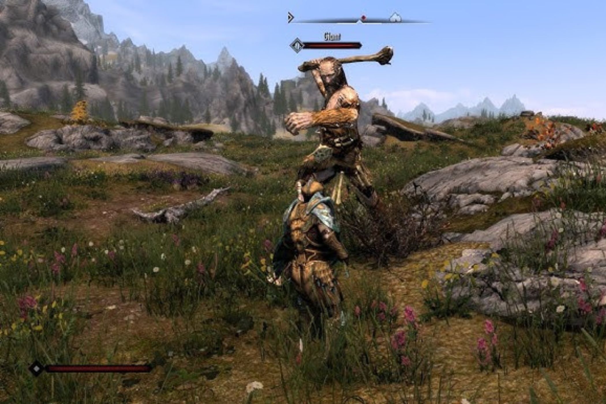 Skyrim player fighting giant in field