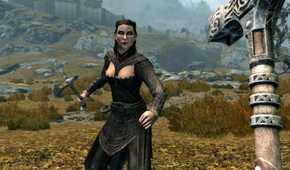Skyrim player with hammer fighting woman in field