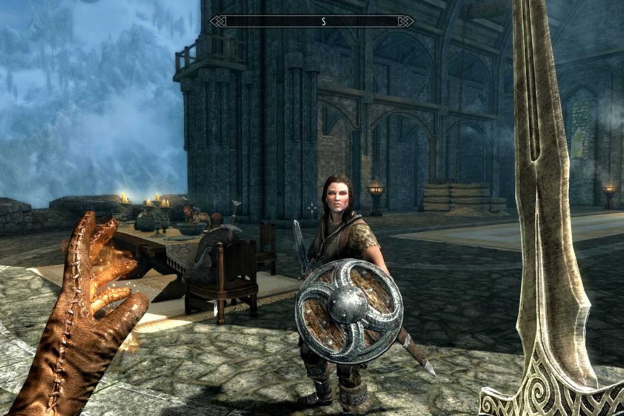 Skyrim player fighting NPC with sword