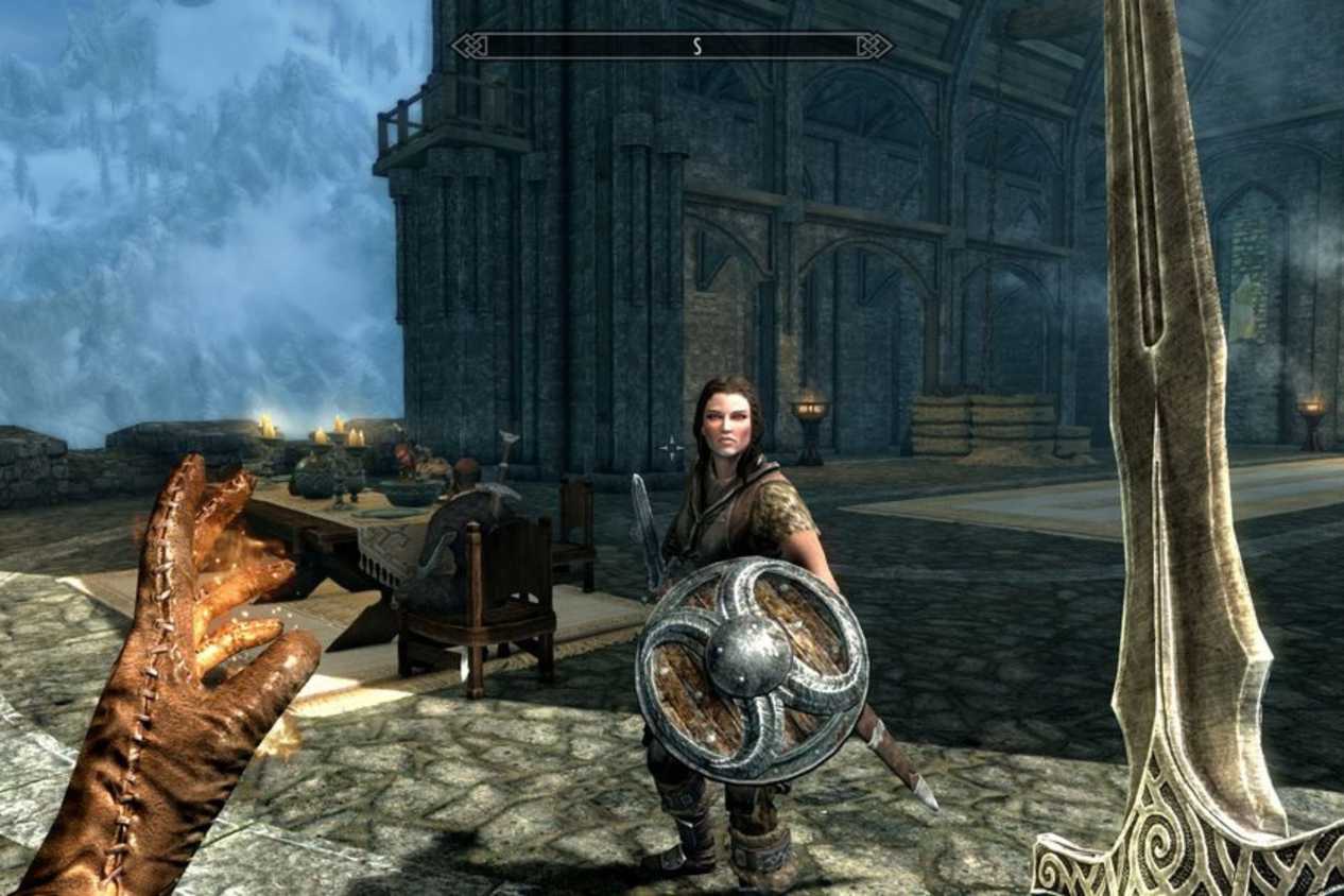 Skyrim player fighting NPC with sword