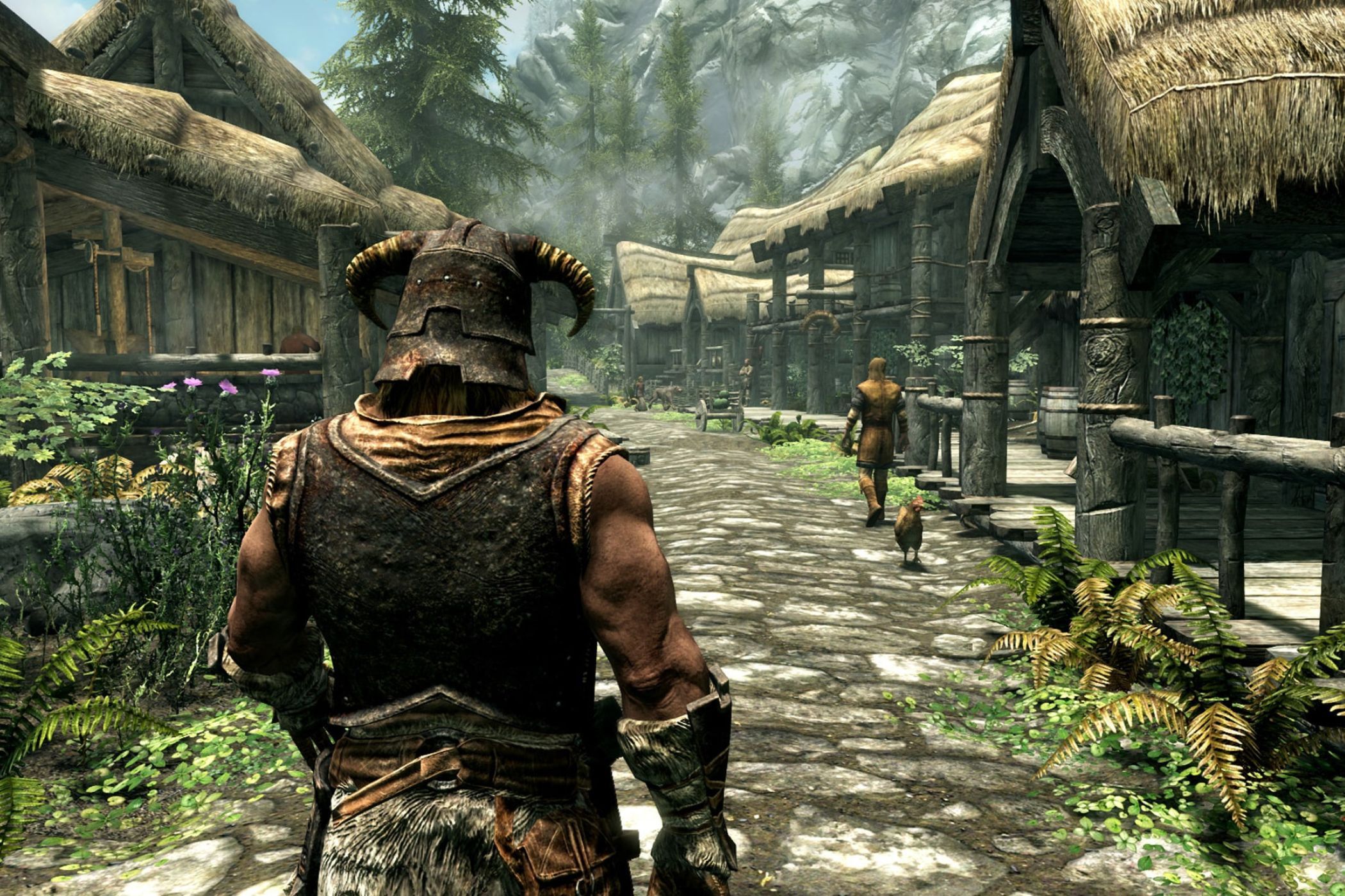 Skyrim player walking through starting town