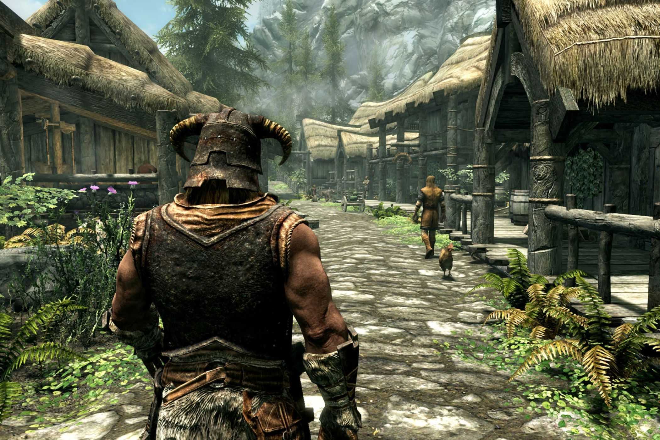 Skyrim player walking through starting town