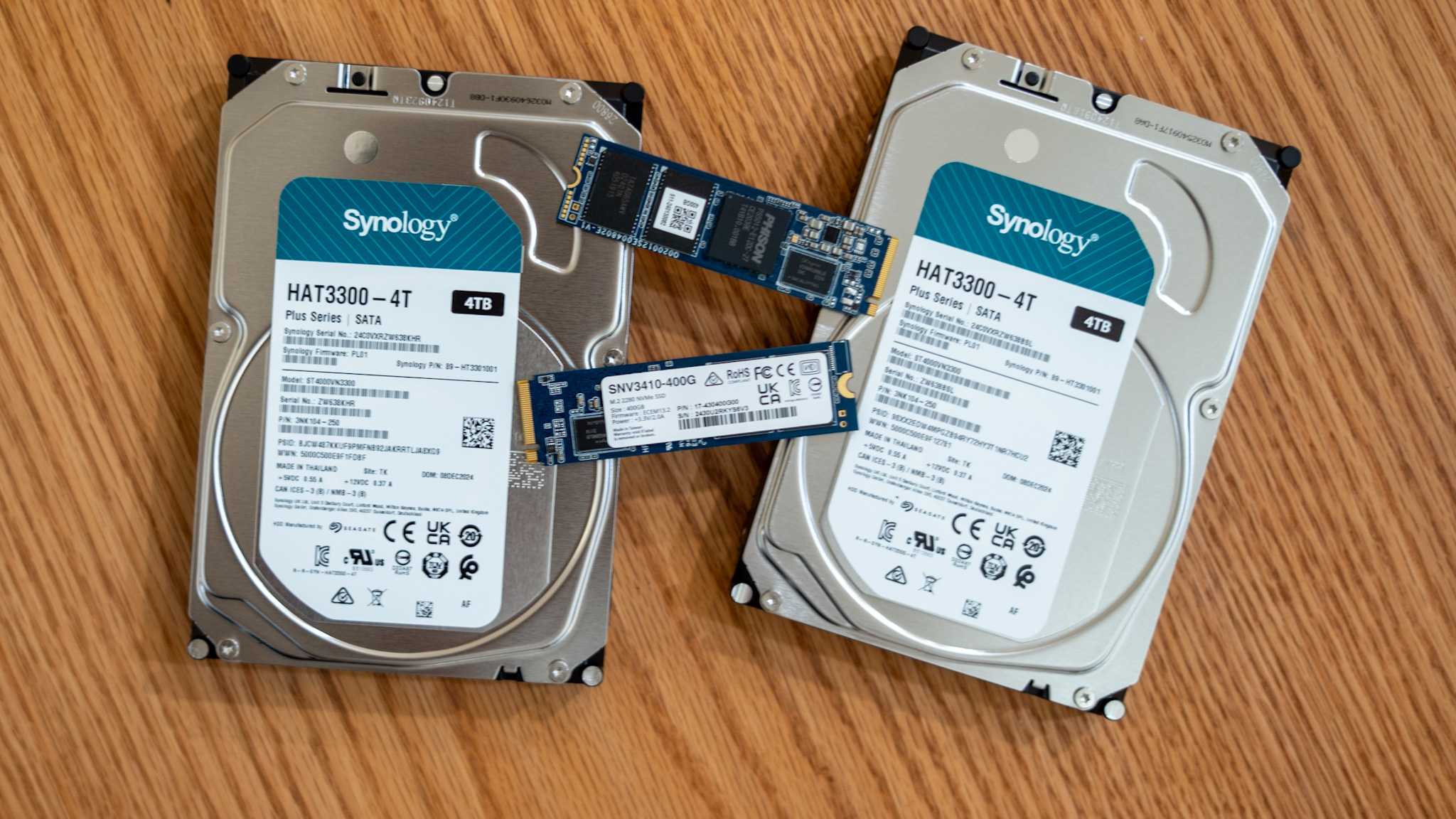 Synology hard drives or HDDs and SSDs lying on a desk