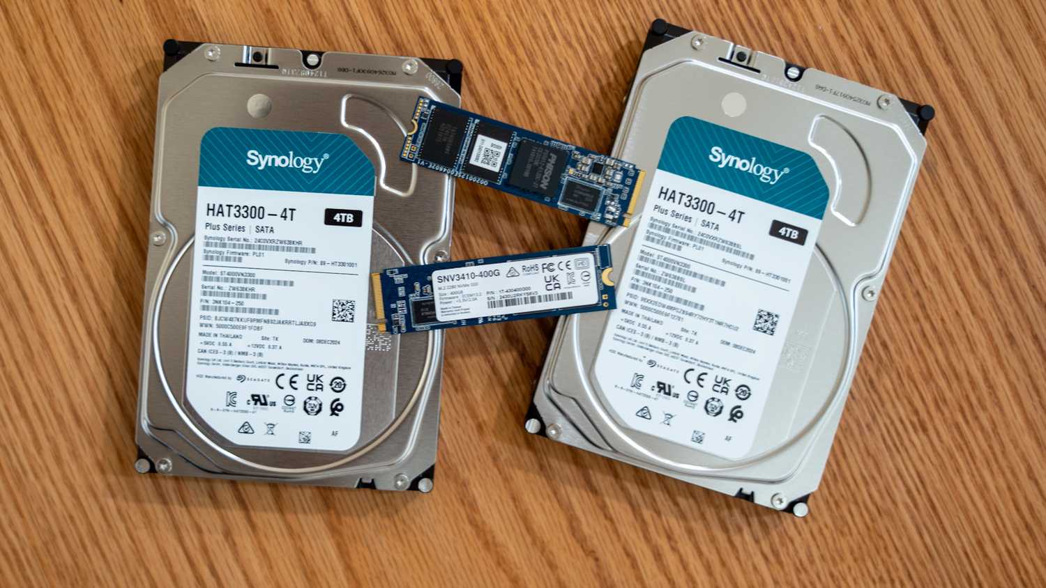 Synology hard drives or HDDs and SSDs lying on a desk