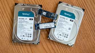 Synology hard drives or HDDs and SSDs lying on a desk