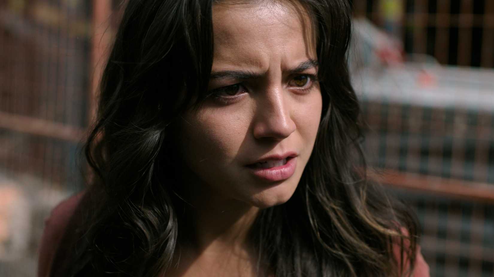 Isabela Merced as Dina looking determined in HBO's The Last of Us, season 2, episode 5.