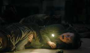 Ellie pinned down by stalkers in HBO's The Last of Us, season 2, episode 5.