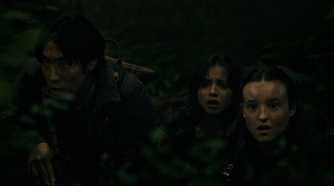 Jesse, Dina, and Ellie looking afraid while hiding in HBO's The Last of Us, season 2, episode 5.