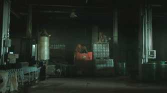 Mutliple stalkers sitting atop crates in HBO's The Last of Us, season 2, episode 5.