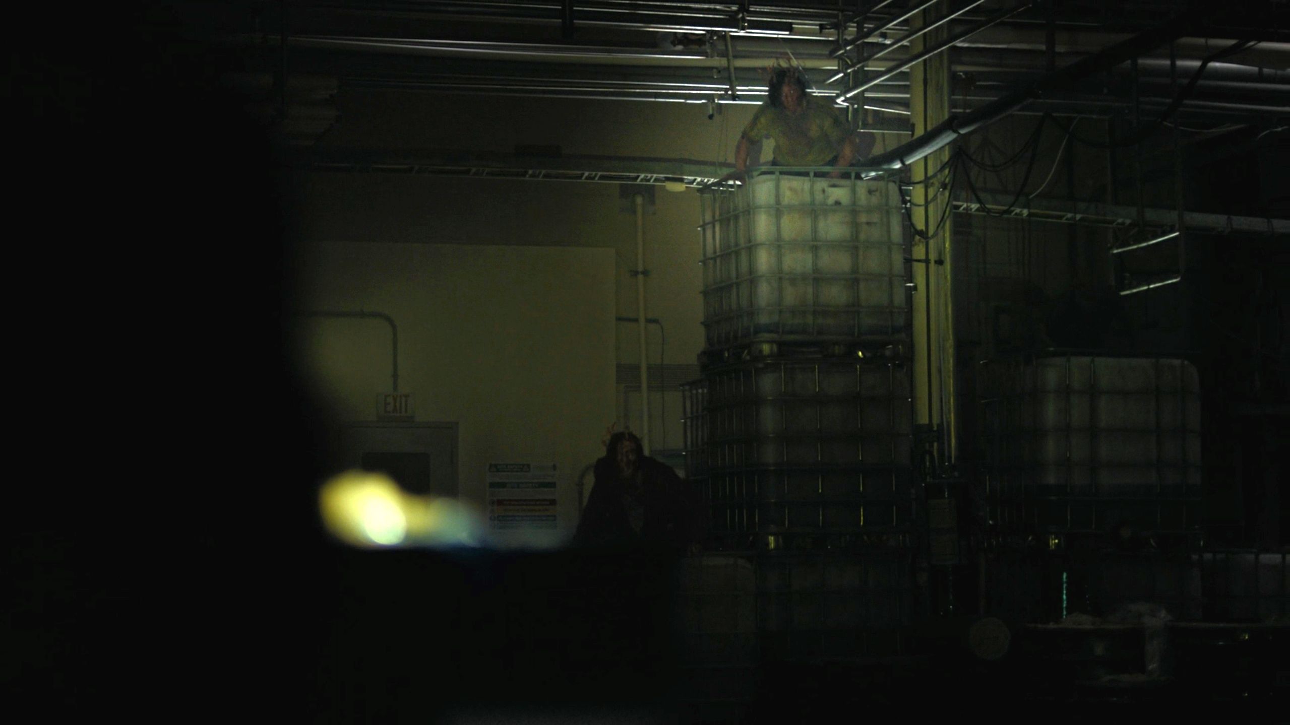 Stalkers visible in flashlight in HBO's The Last of Us, season 2, episode 5.